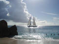 Charter boat passing Cupecoy beach in the afternoon